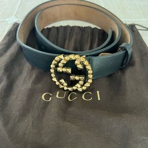 Black Gucci belt with Gold spiked front Gucci emblem